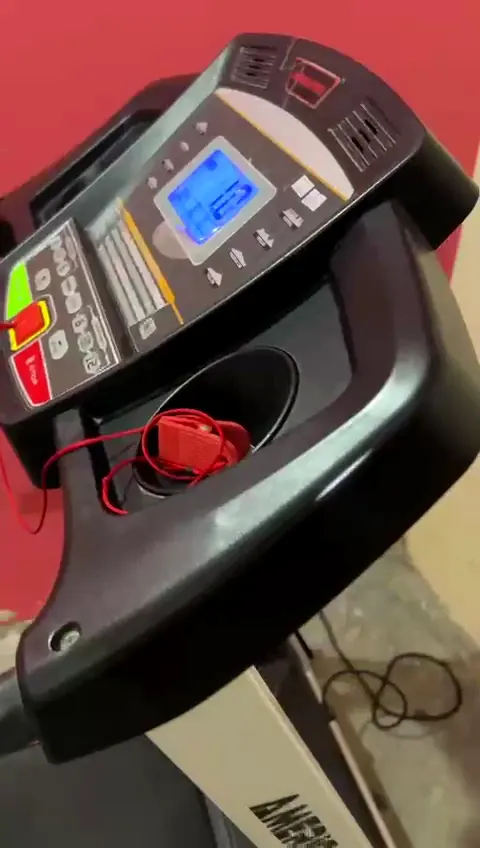 A treadmill console opened up for repair