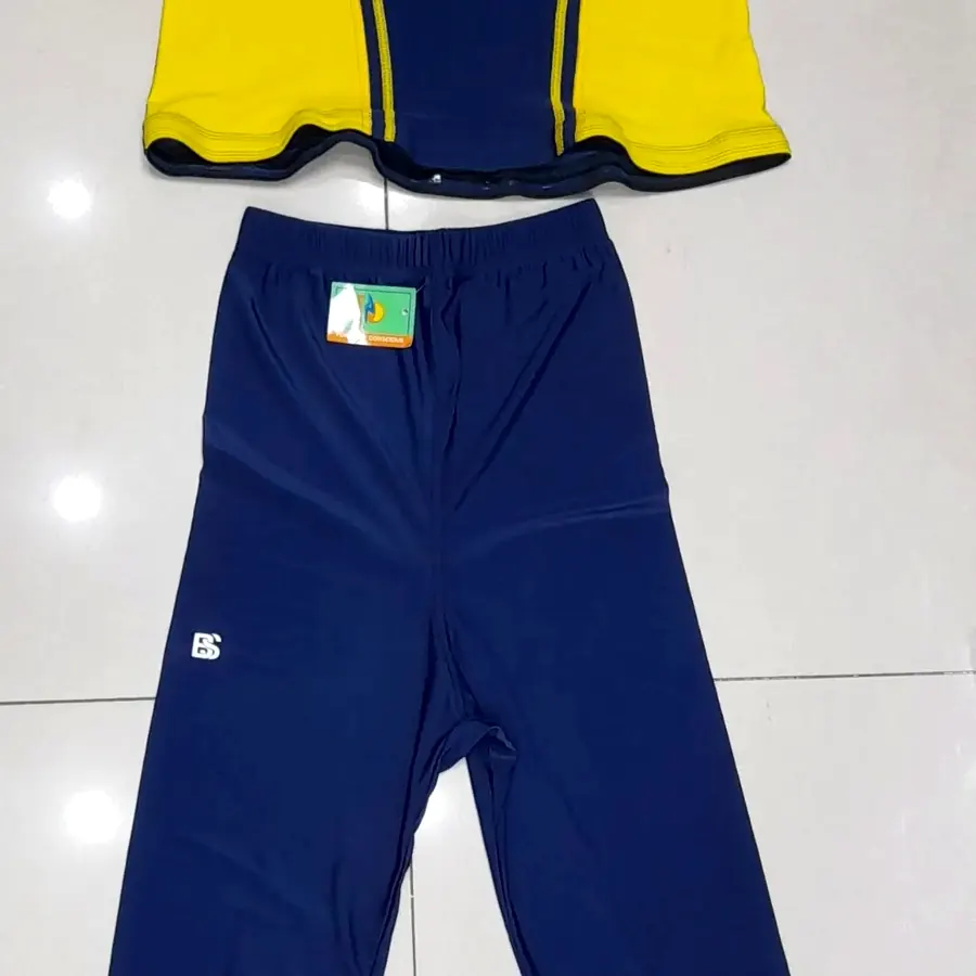 Swimming costumes and caps on display